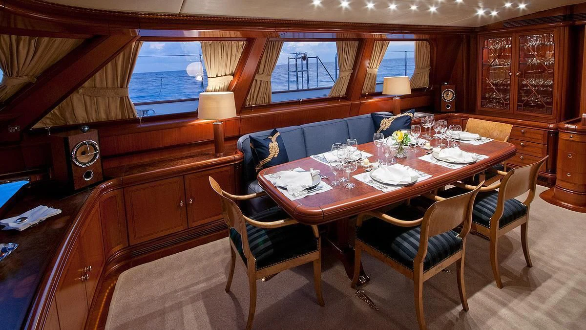 a dining table in a cabin aboard HYPERION Yacht for Charter