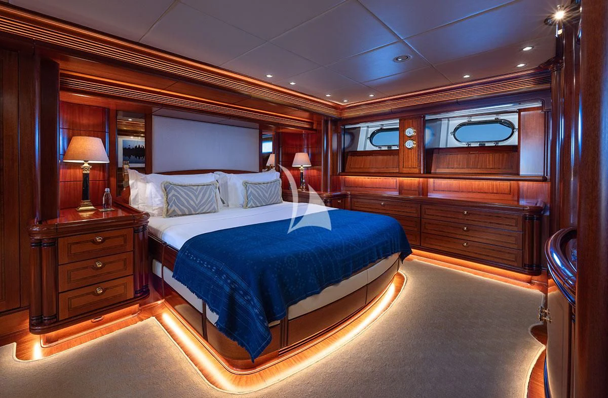 a bedroom with a large bed aboard HYPERION Yacht for Charter