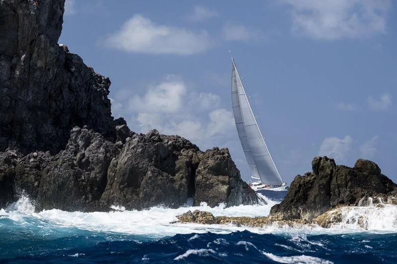 a waterfall in a rocky area aboard HYPERION Yacht for Charter