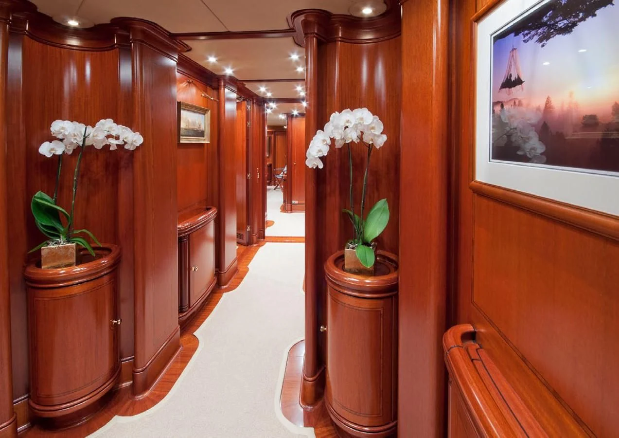 a room with vases and flowers aboard HYPERION Yacht for Charter