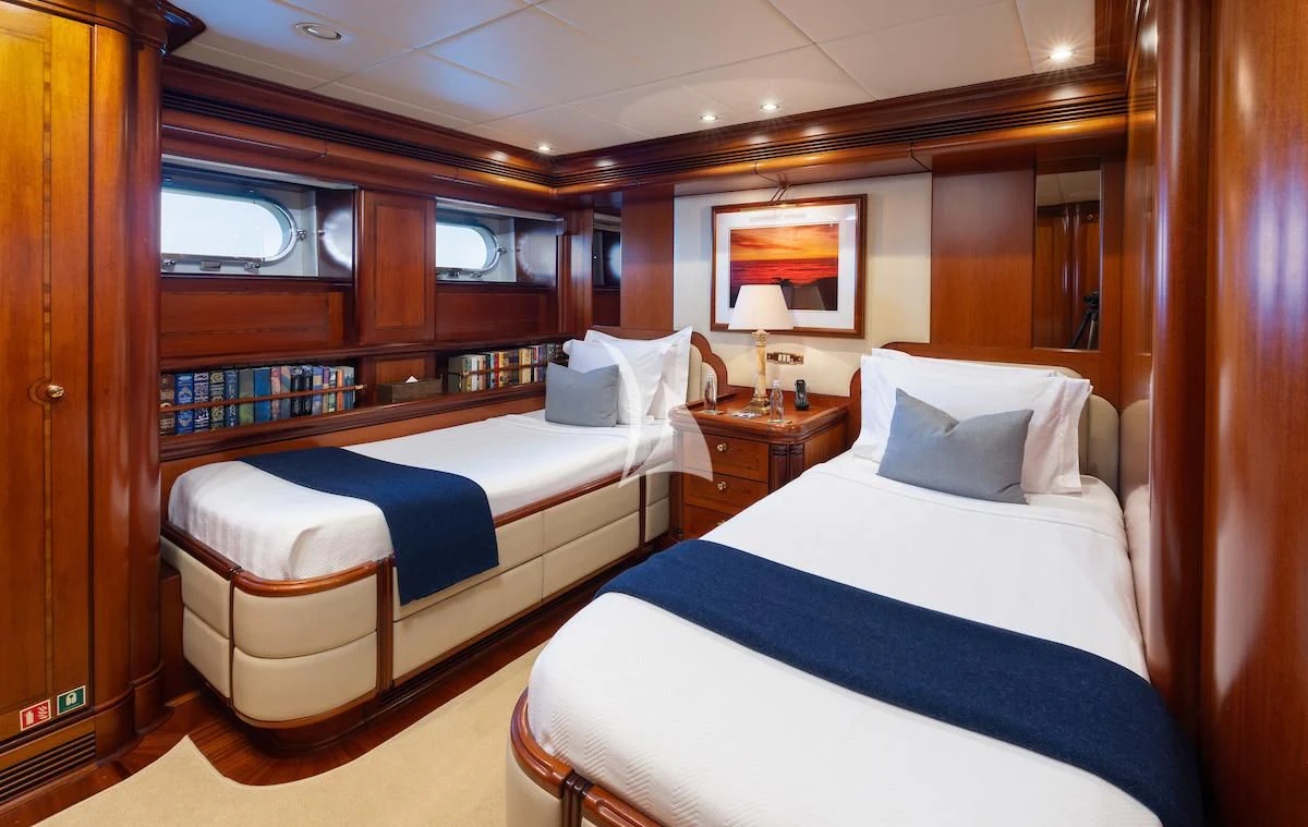 a couple of beds in a room aboard HYPERION Yacht for Charter