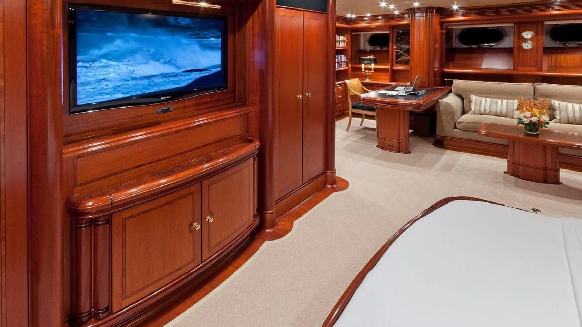 a living room with a tv and furniture aboard HYPERION Yacht for Charter