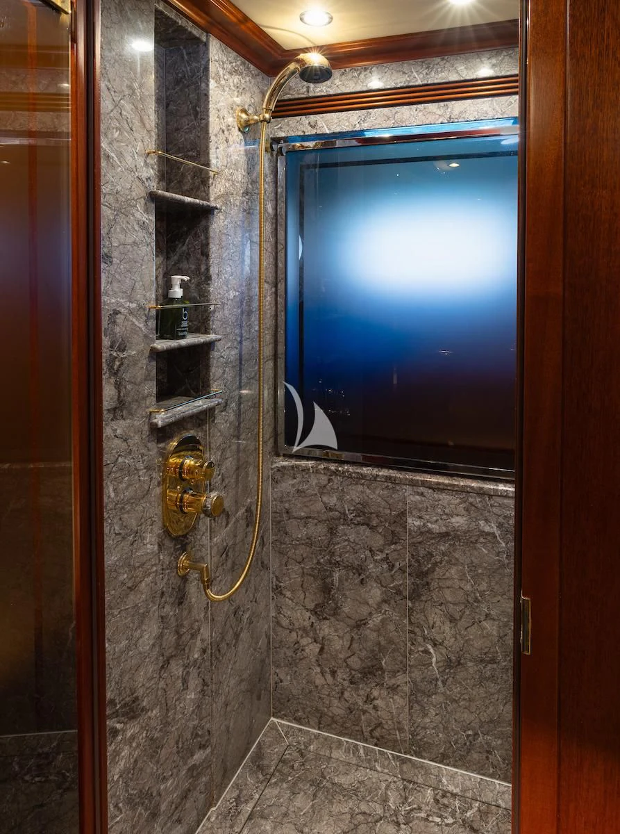 a bathroom with a large window aboard HYPERION Yacht for Charter