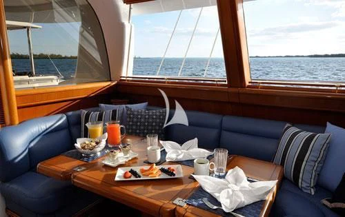 a table with food and drinks on it aboard HYPERION Yacht for Charter