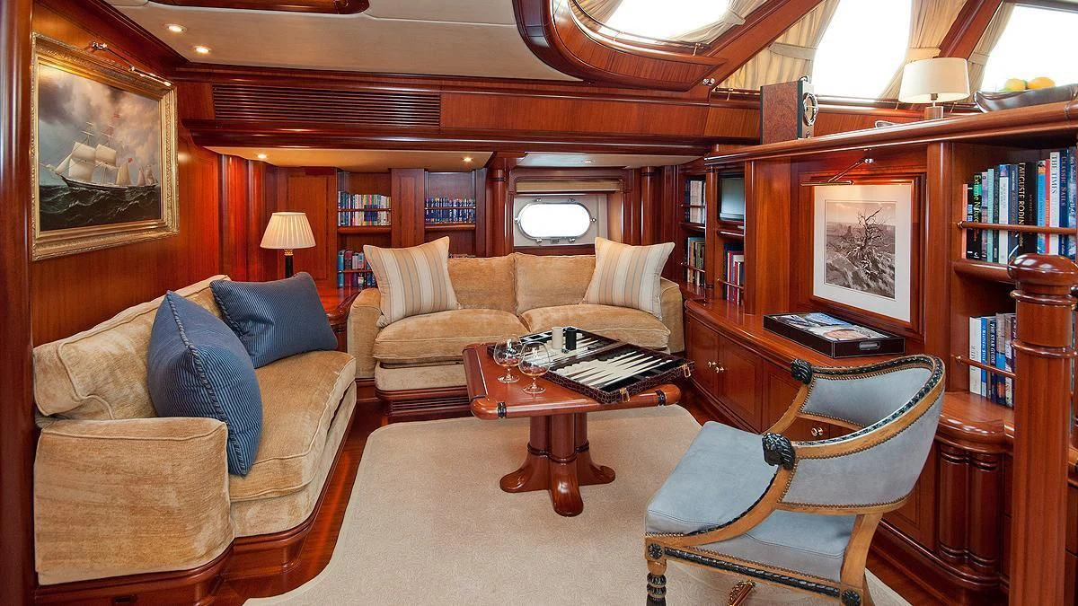 a living room with a couch and a coffee table aboard HYPERION Yacht for Charter