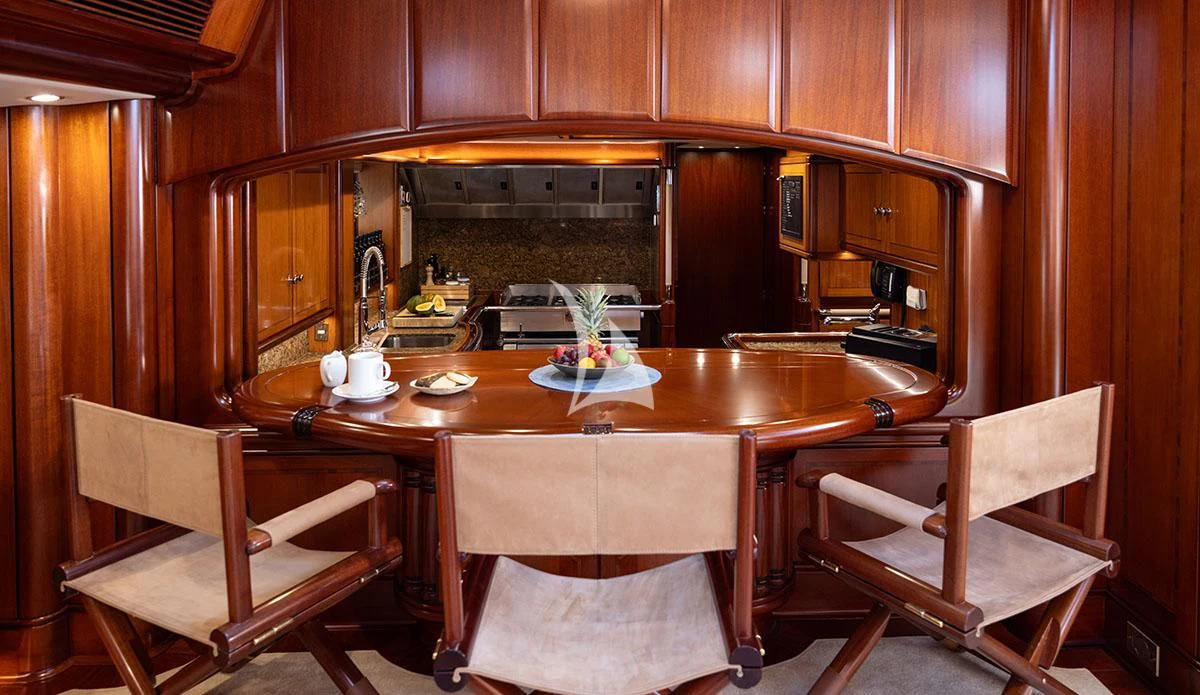 a kitchen with wooden cabinets aboard HYPERION Yacht for Charter