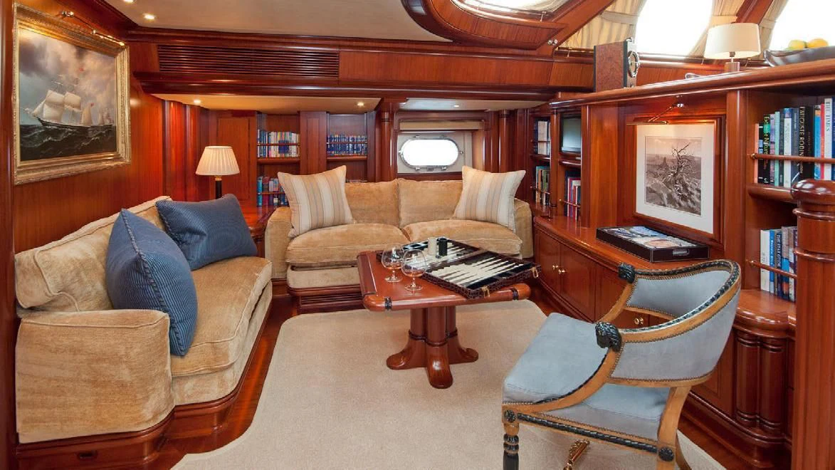 a living room with a couch and a coffee table aboard HYPERION Yacht for Charter