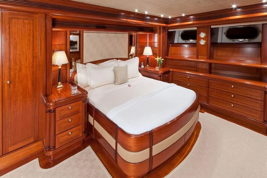 a large bed in a room aboard HYPERION Yacht for Charter