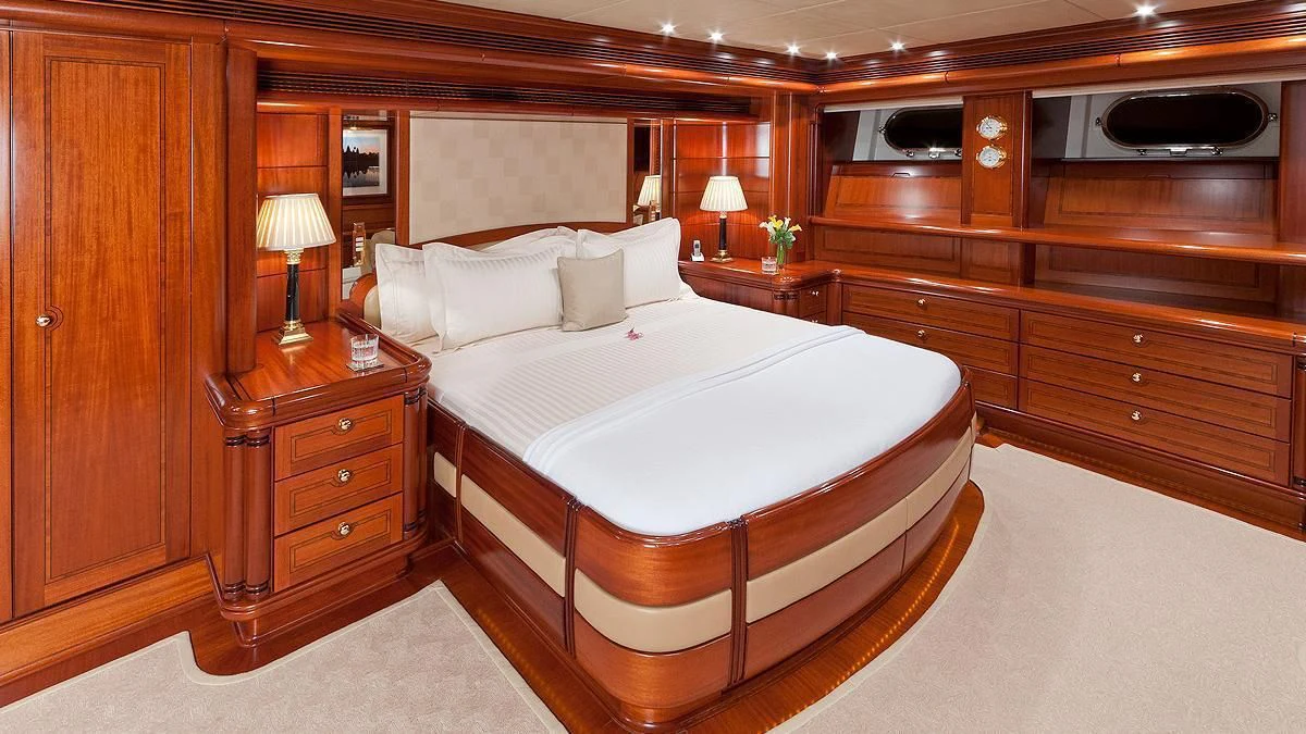 a large bed in a room aboard HYPERION Yacht for Charter