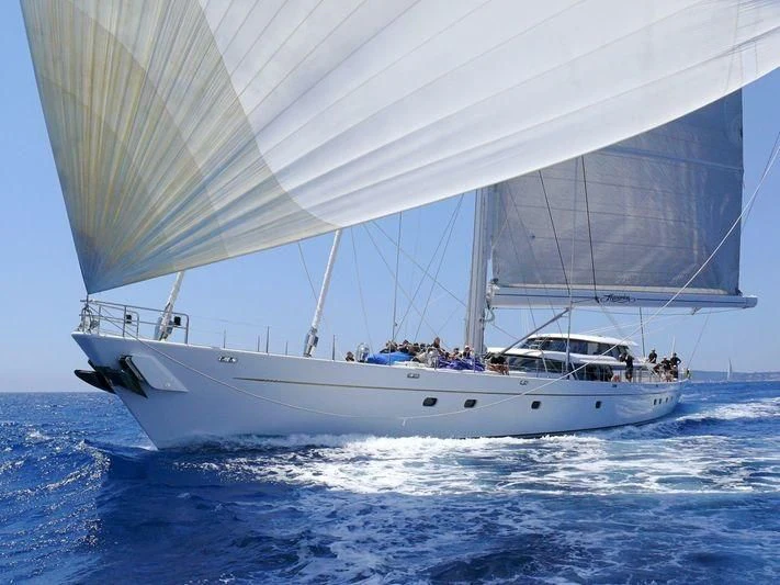 a boat sailing on the water aboard HYPERION Yacht for Charter