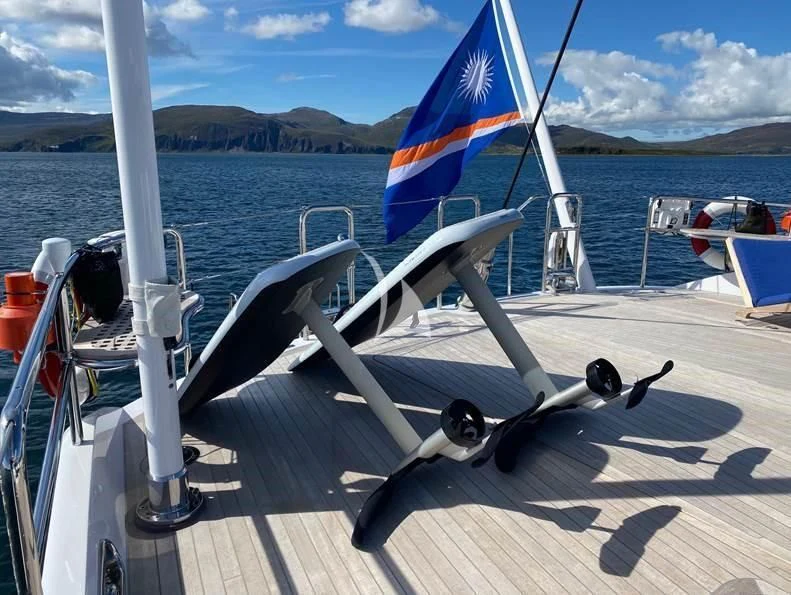 a boat with a flag on it aboard HYPERION Yacht for Charter