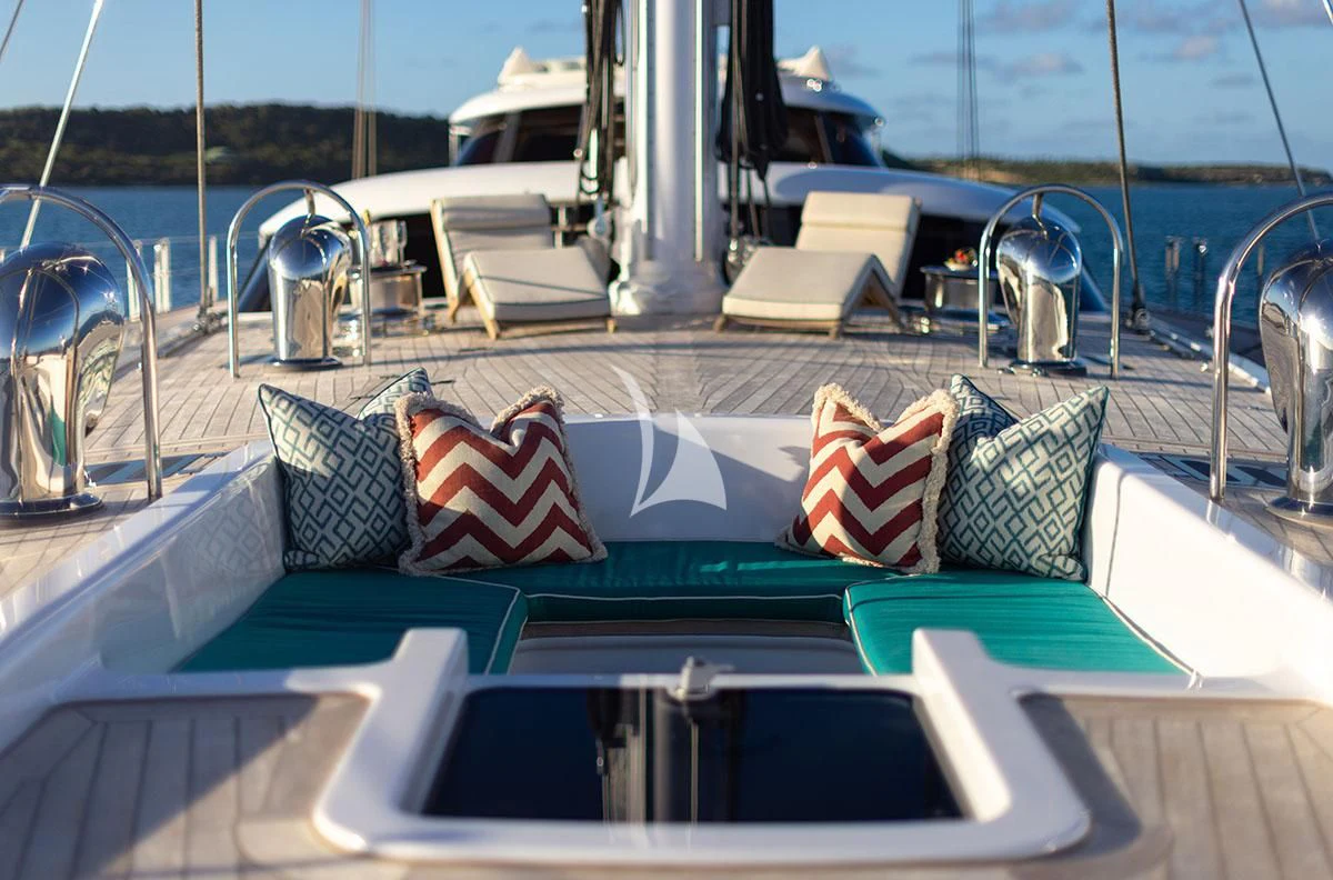 a table with chairs and pillows on it aboard HYPERION Yacht for Charter
