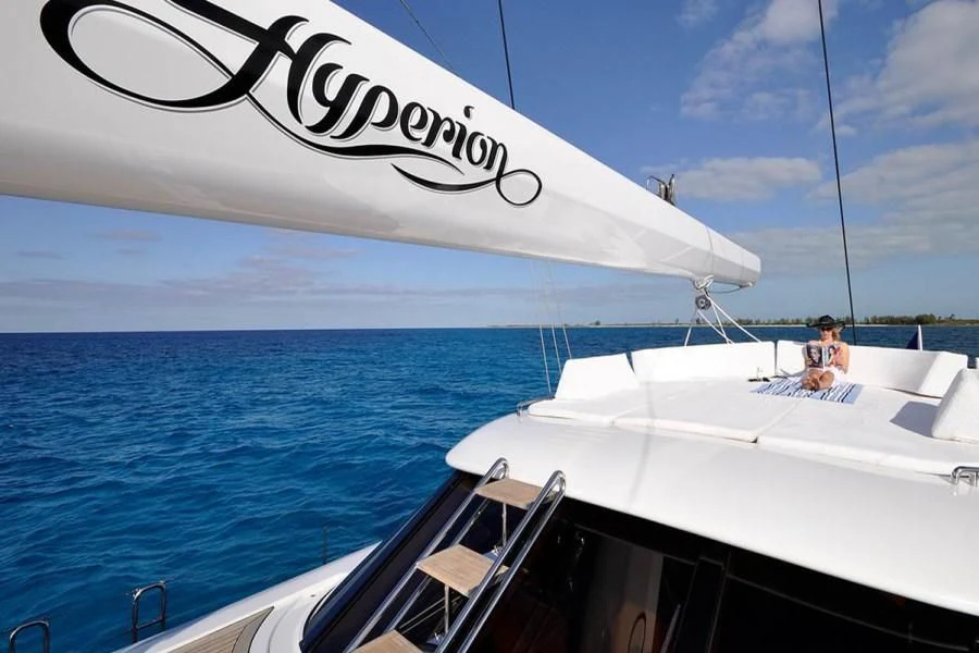 a couple of people on a boat aboard HYPERION Yacht for Charter
