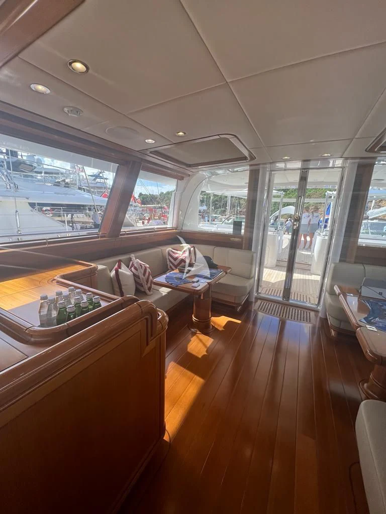 a room with a couch and a table aboard HYPERION Yacht for Charter