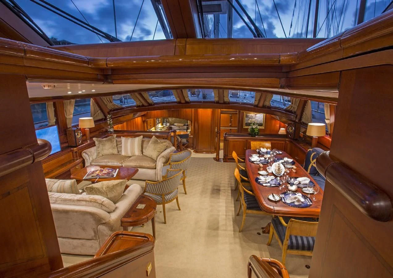 a living room with a large window aboard HYPERION Yacht for Charter