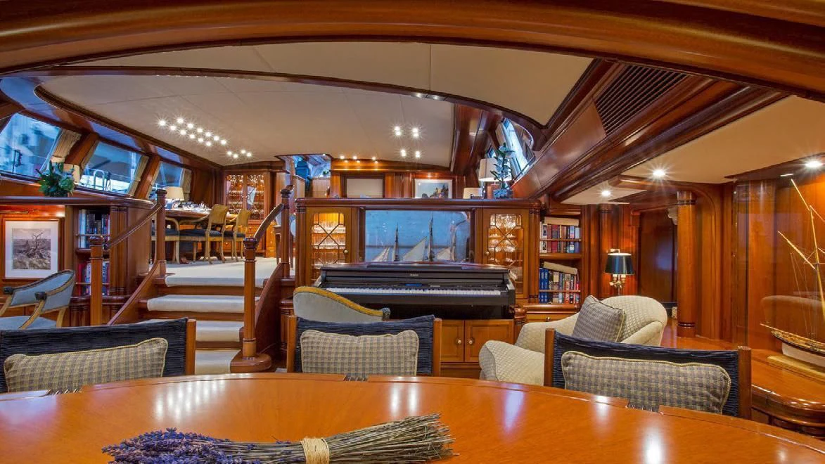 a room with a table and chairs aboard HYPERION Yacht for Charter