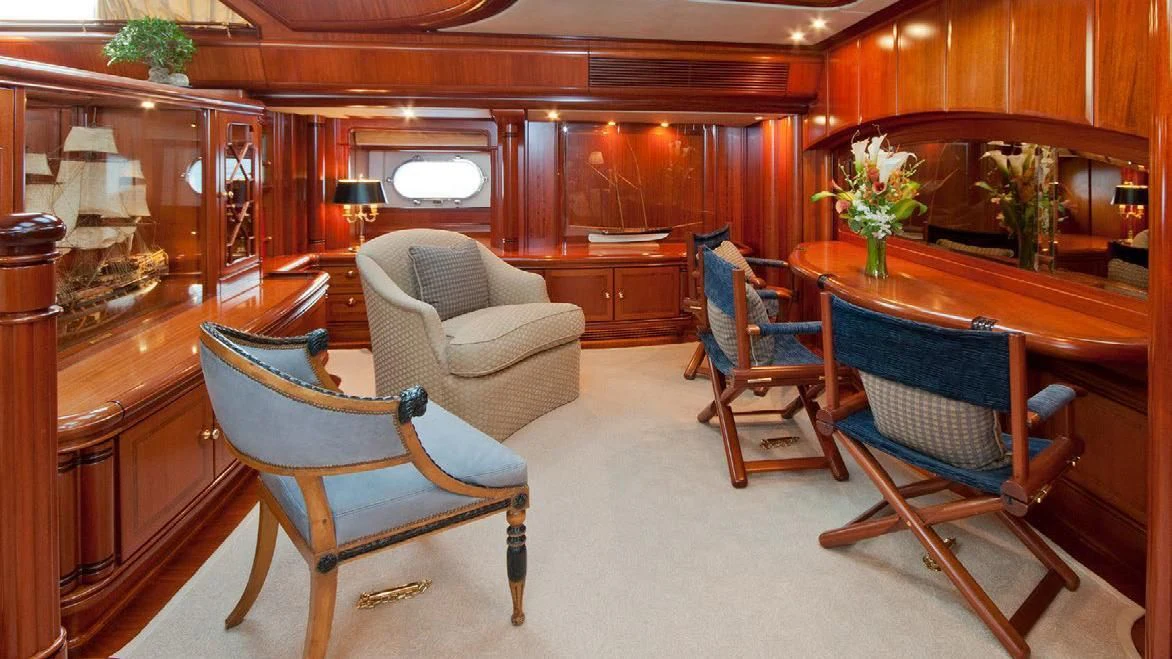 a living room with chairs and a table aboard HYPERION Yacht for Charter
