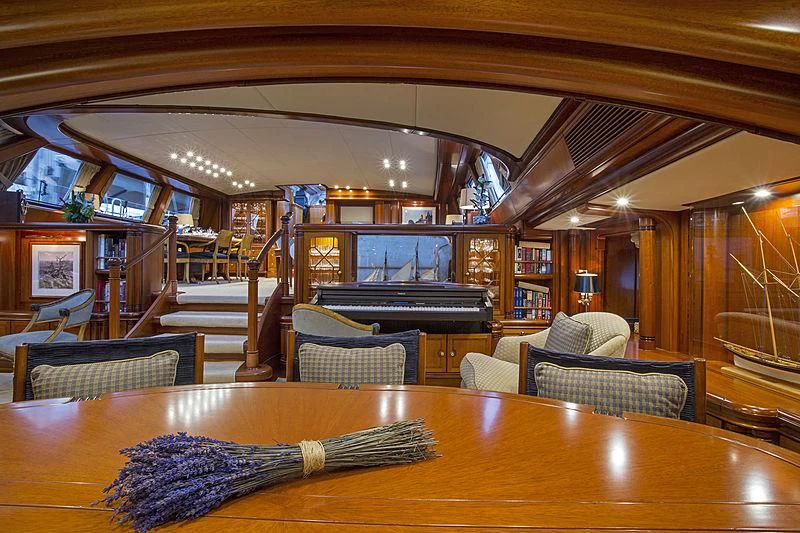 a room with a table and chairs aboard HYPERION Yacht for Charter