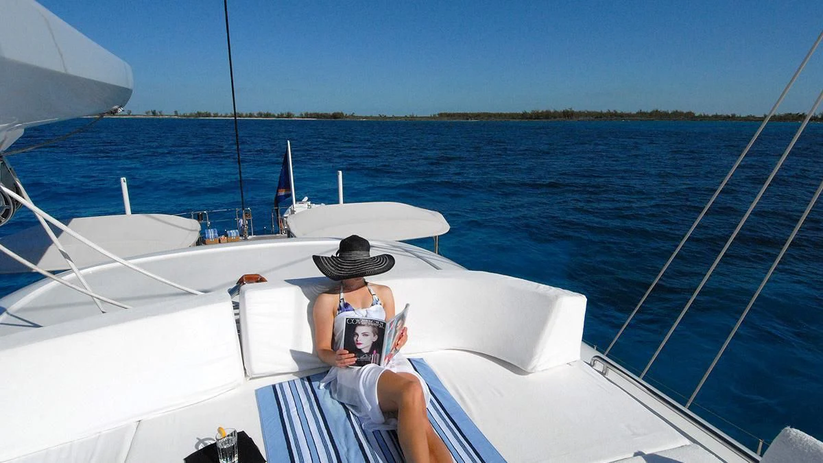 a person sitting on a boat aboard HYPERION Yacht for Charter