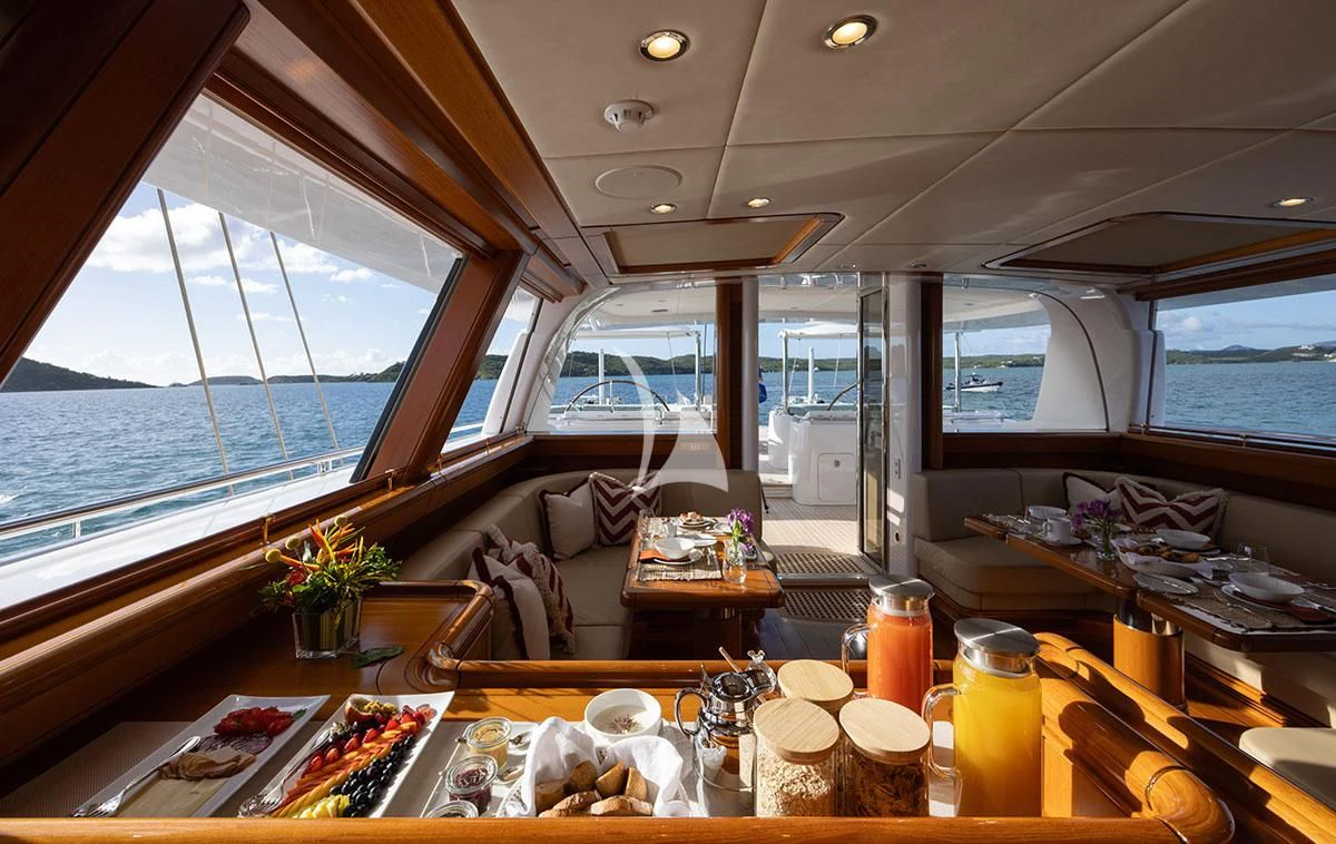 a room with a table and chairs aboard HYPERION Yacht for Charter