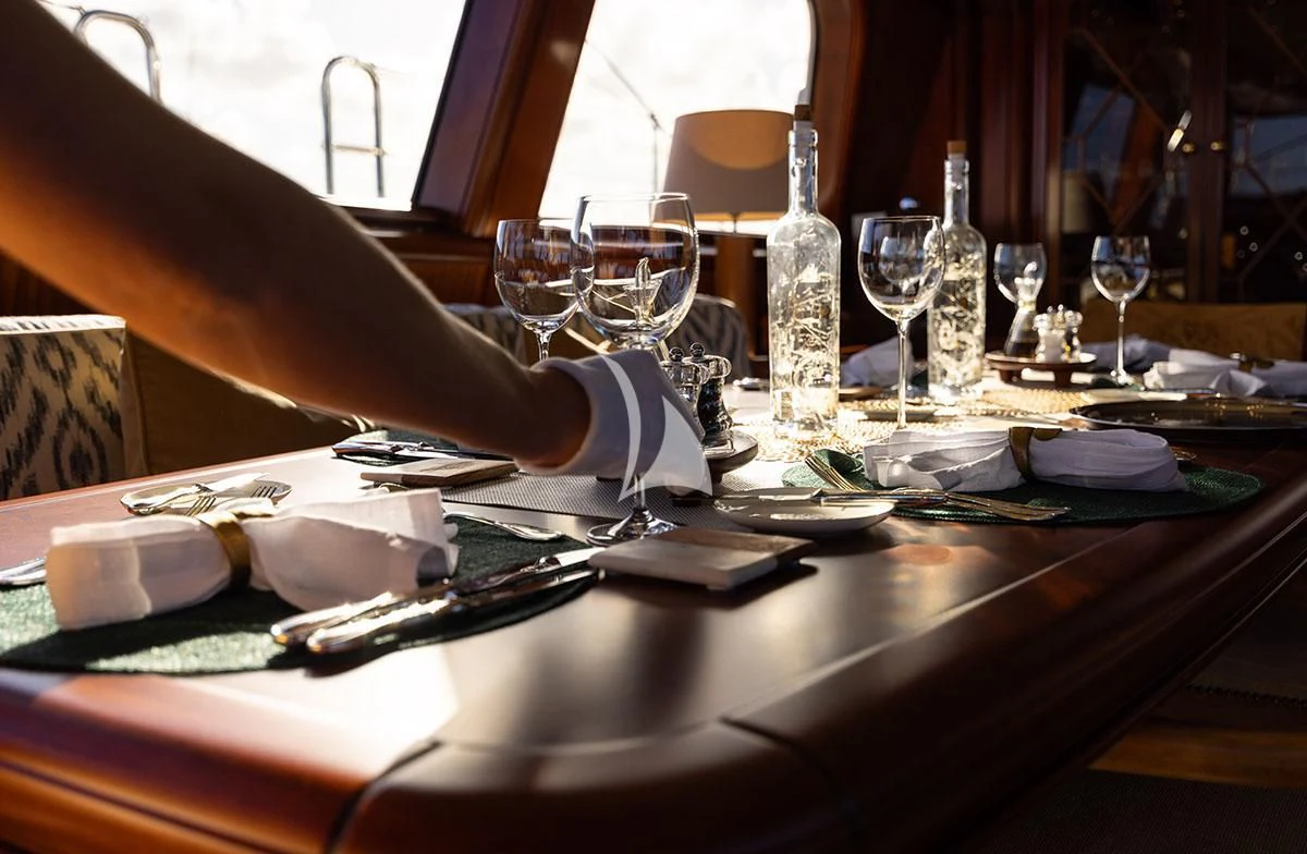 a table with wine glasses and napkins on it aboard HYPERION Yacht for Charter