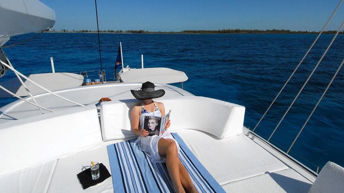 a man and woman on a boat aboard HYPERION Yacht for Charter