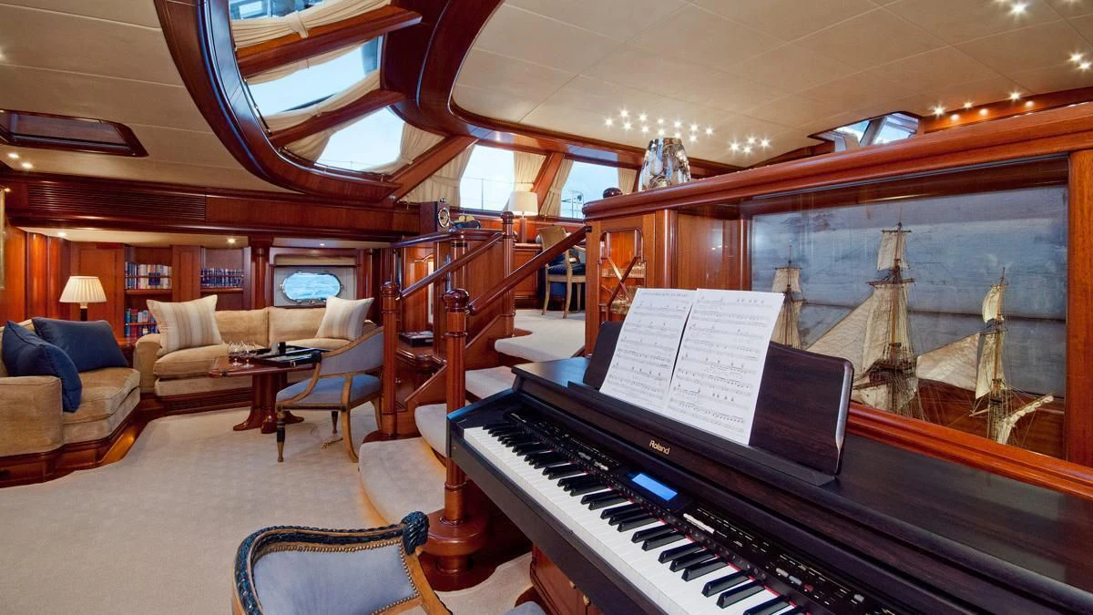 a piano in a room aboard HYPERION Yacht for Charter