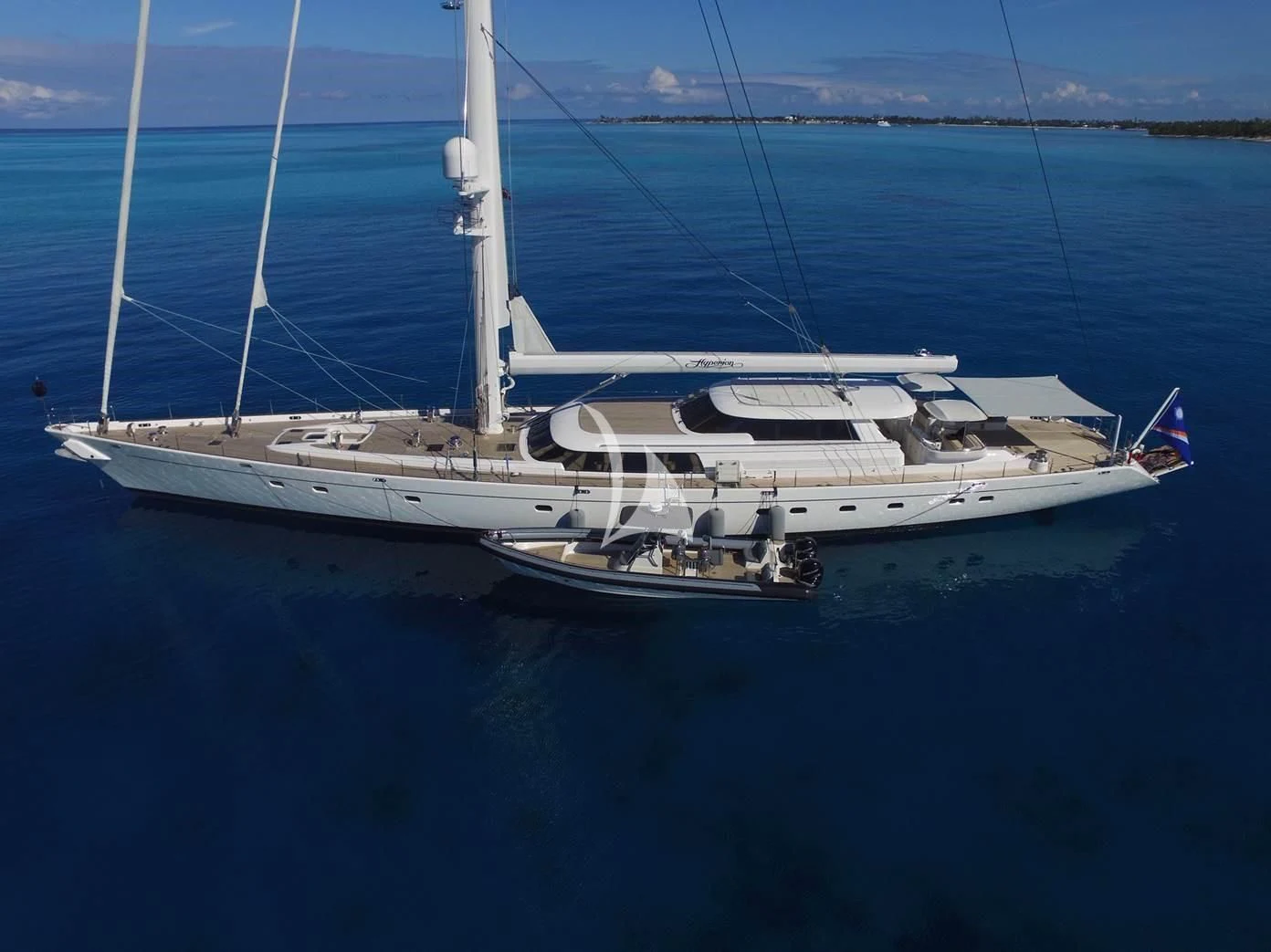 a white boat in the water aboard HYPERION Yacht for Charter