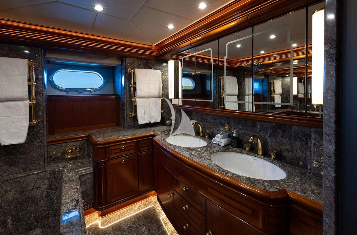 a bathroom with a sink and a mirror aboard HYPERION Yacht for Charter