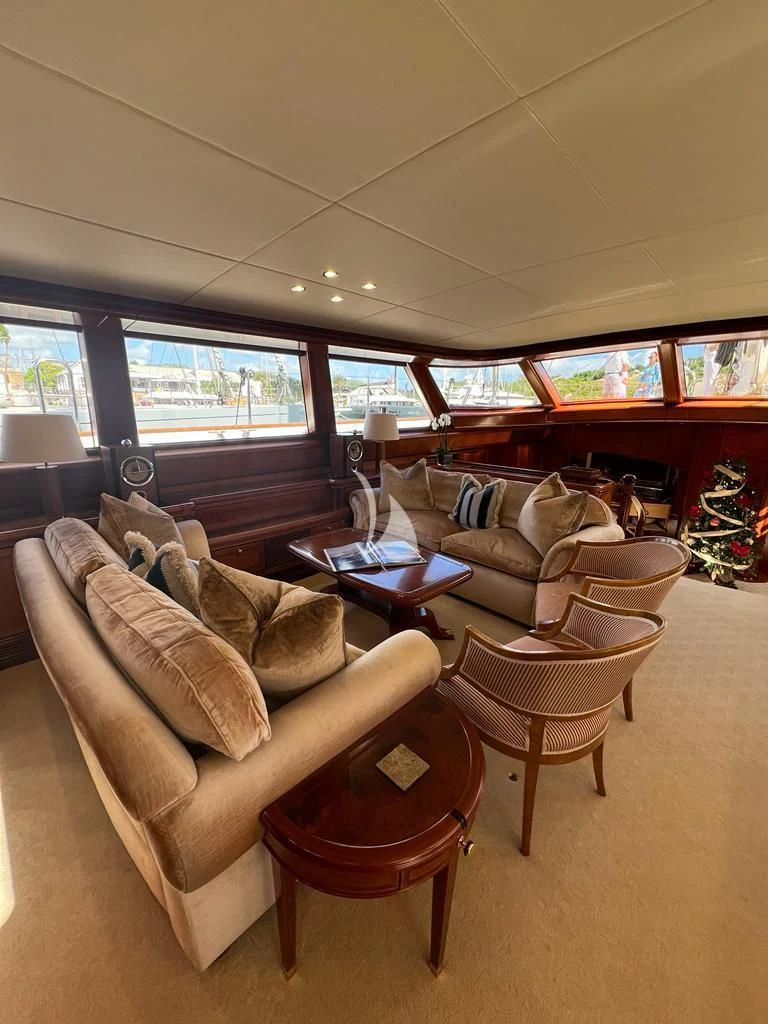 a living room with a couch and a coffee table aboard HYPERION Yacht for Charter