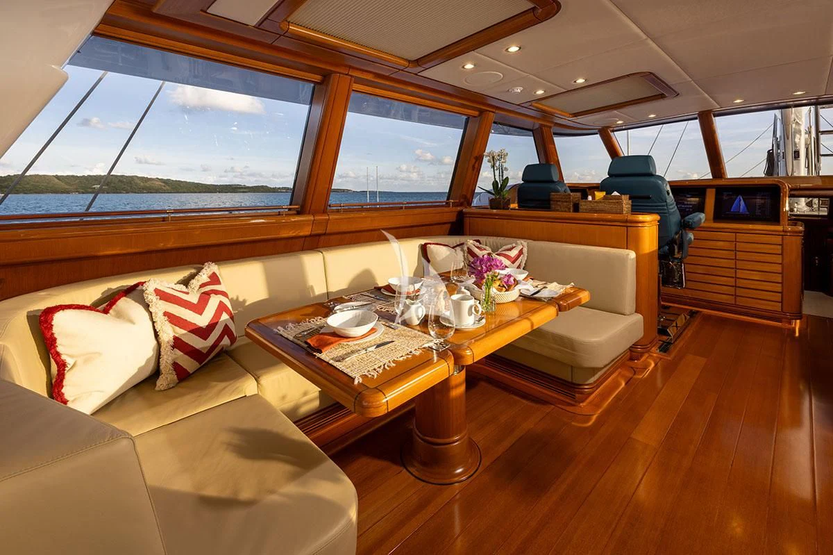 a living room with a table and chairs aboard HYPERION Yacht for Charter
