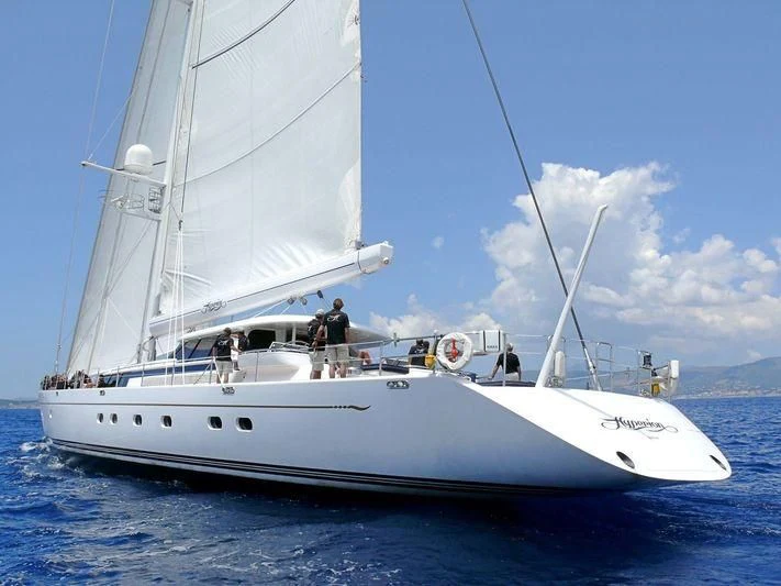 a white boat with people on it aboard HYPERION Yacht for Charter