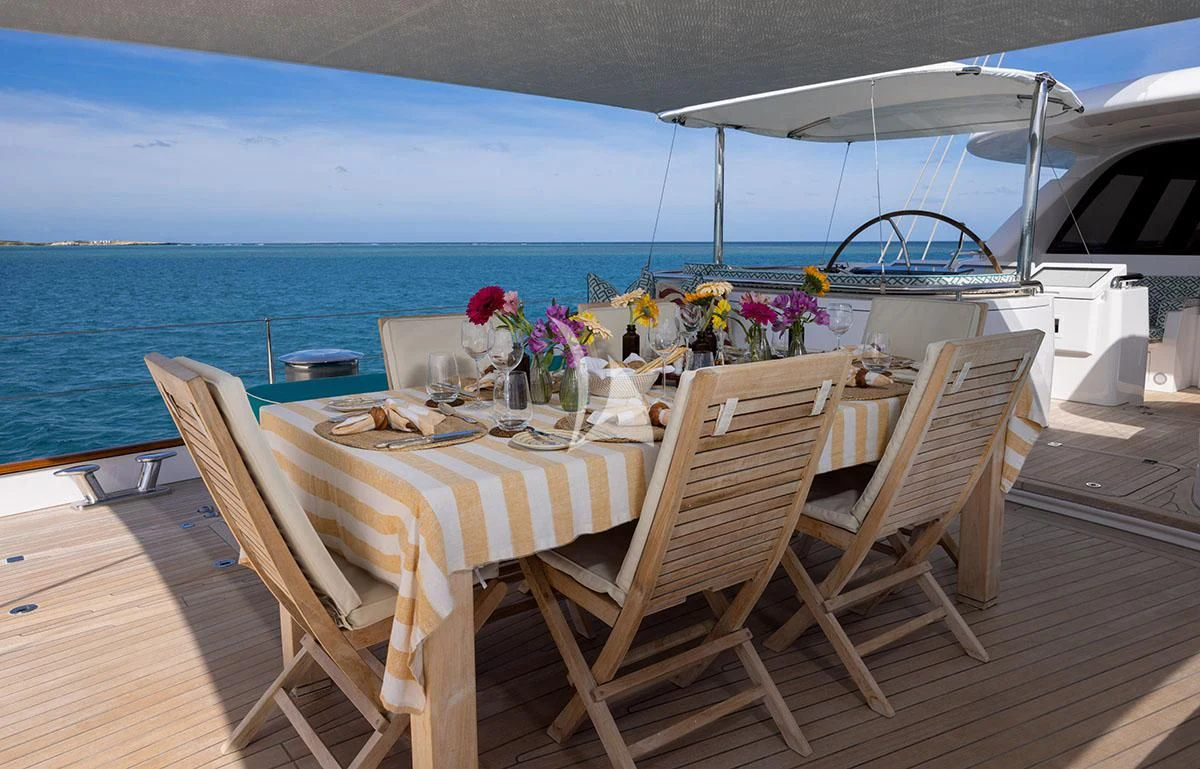 a table set for a dinner on a boat aboard HYPERION Yacht for Charter