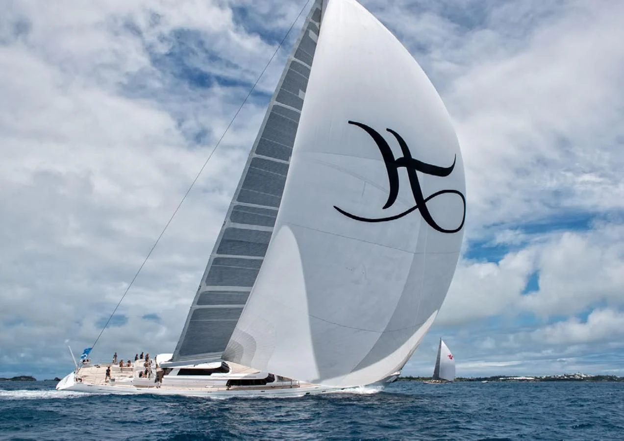 a sailboat with a drawing of a whale on it aboard HYPERION Yacht for Charter