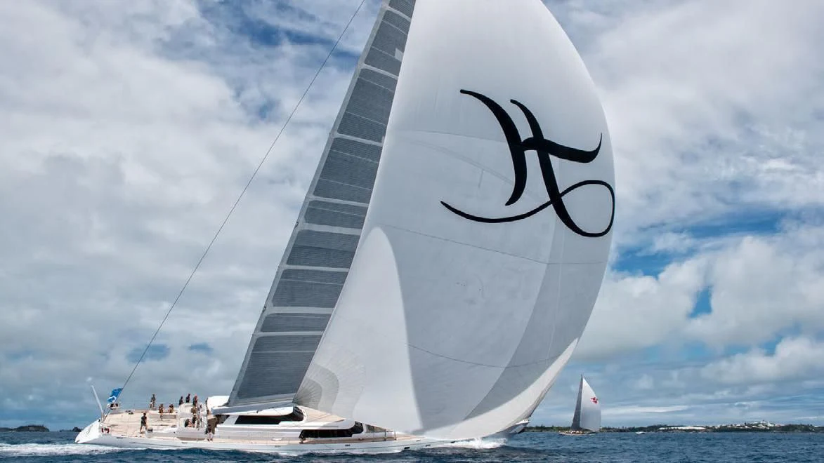 a sailboat with a large sail aboard HYPERION Yacht for Charter