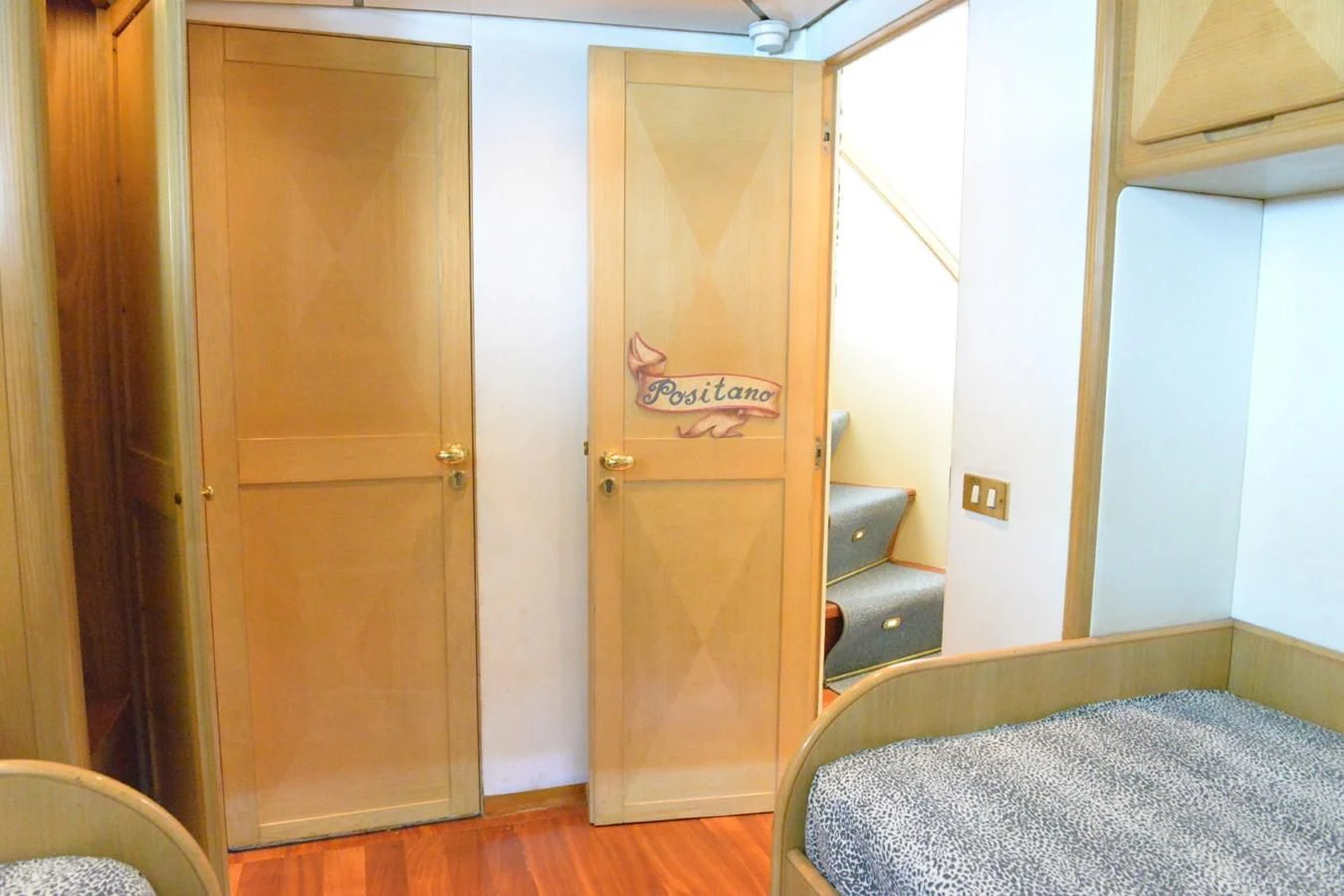 a room with a bed and a closet aboard MISTER P Yacht for Sale