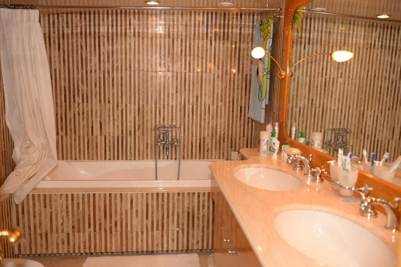 a bathroom with a tub sink and a sink aboard MISTER P Yacht for Sale