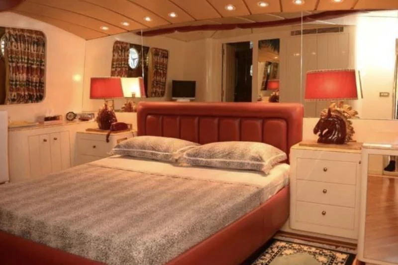 a large bed in a hotel room aboard MISTER P Yacht for Sale
