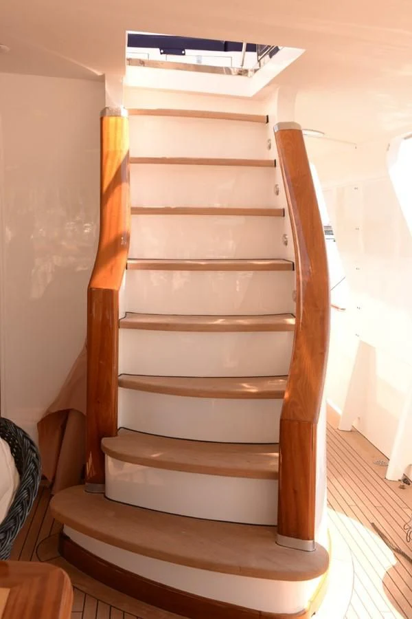a wooden staircase with a ladder aboard MISTER P Yacht for Sale