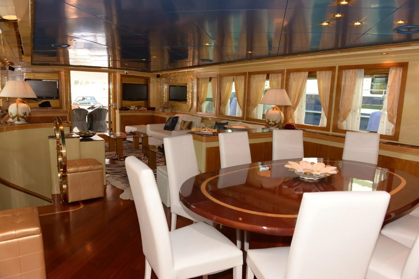 a large room with a table and chairs aboard MISTER P Yacht for Sale