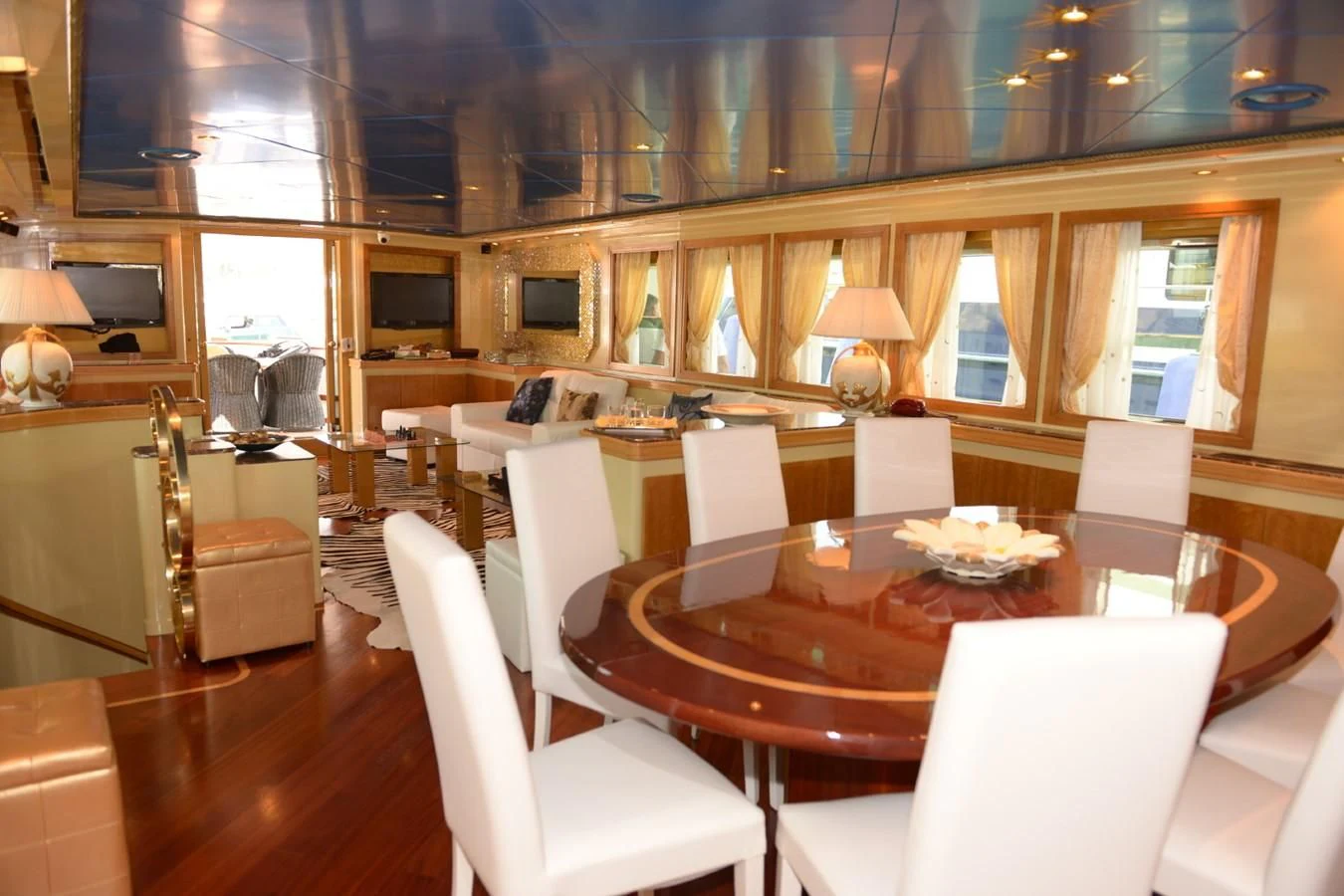 a large room with a table and chairs aboard MISTER P Yacht for Sale