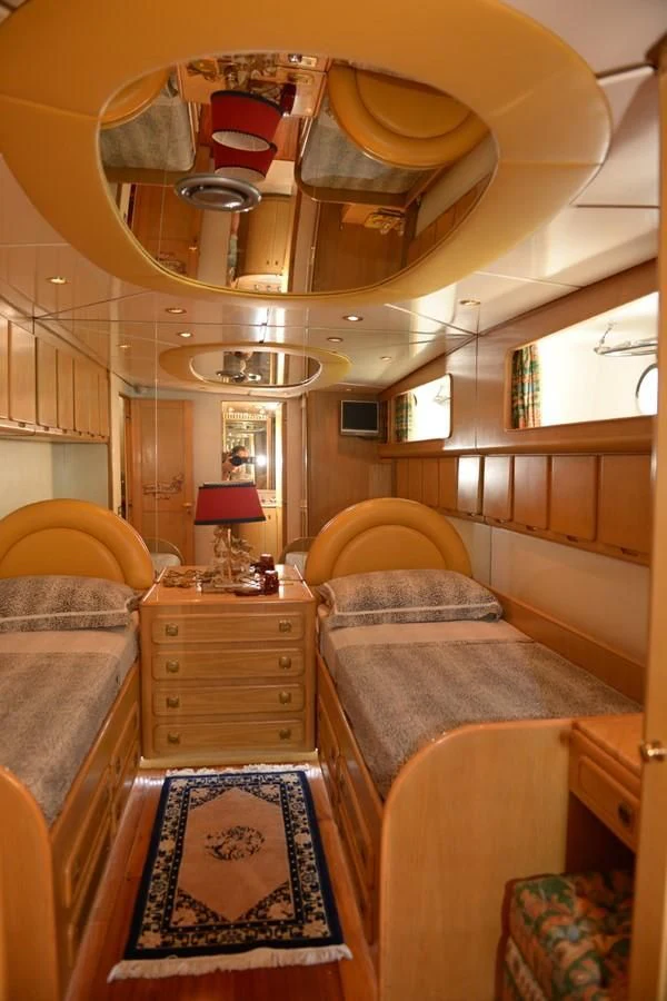 a room with a bed and a table aboard MISTER P Yacht for Sale