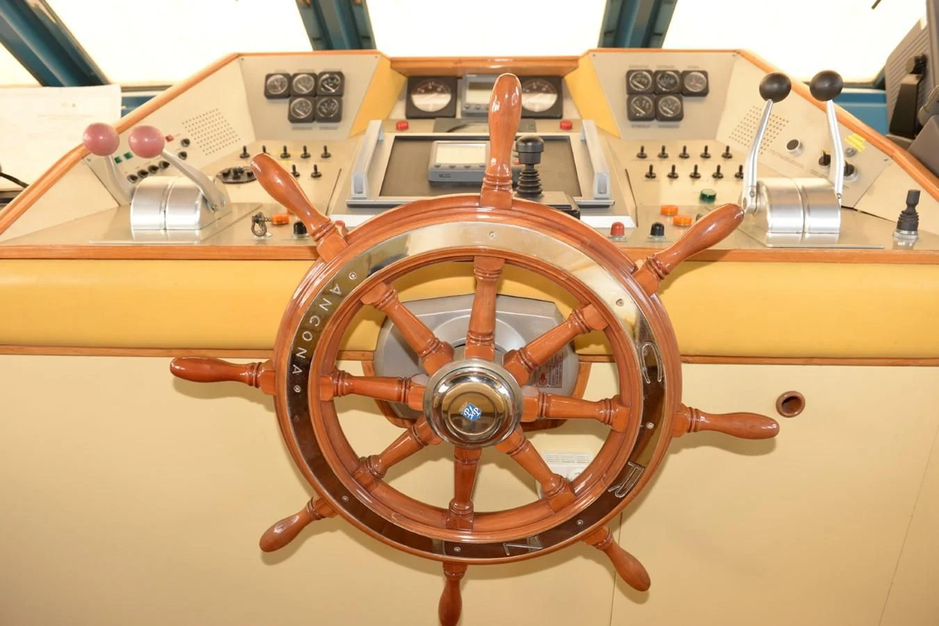 a wooden steering wheel aboard MISTER P Yacht for Sale