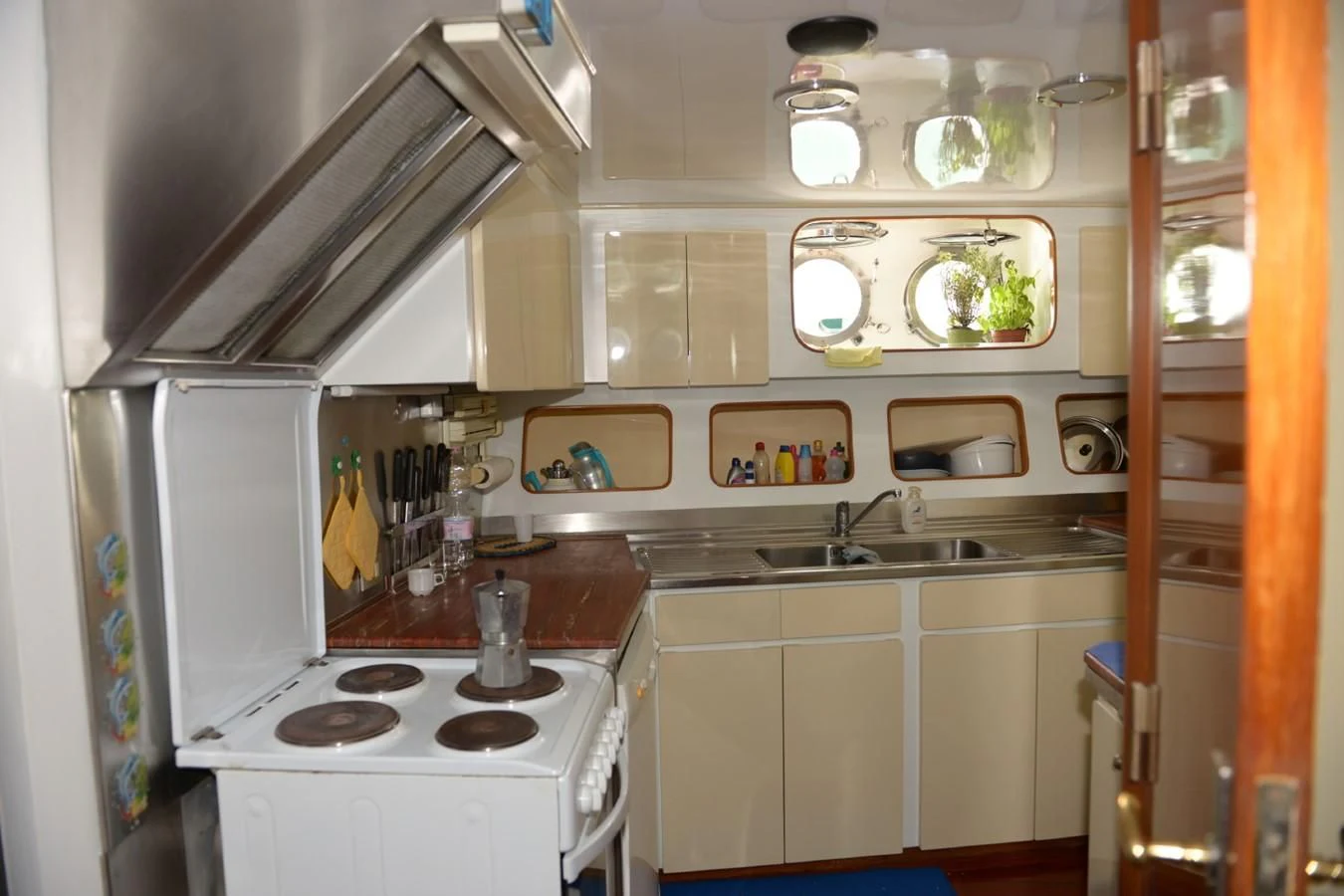a kitchen with a stove and a sink aboard MISTER P Yacht for Sale