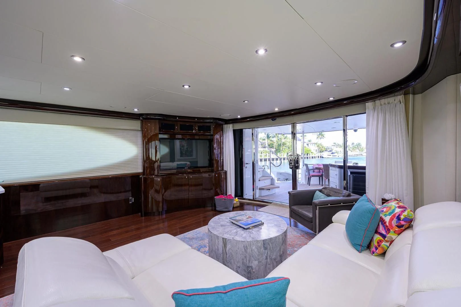 a living room with a large window aboard THE JOB FATHER Yacht for Sale