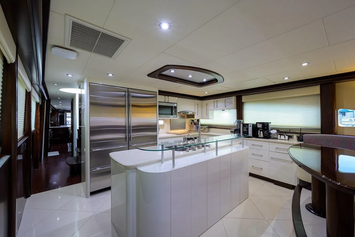 a kitchen with a glass door aboard THE JOB FATHER Yacht for Sale