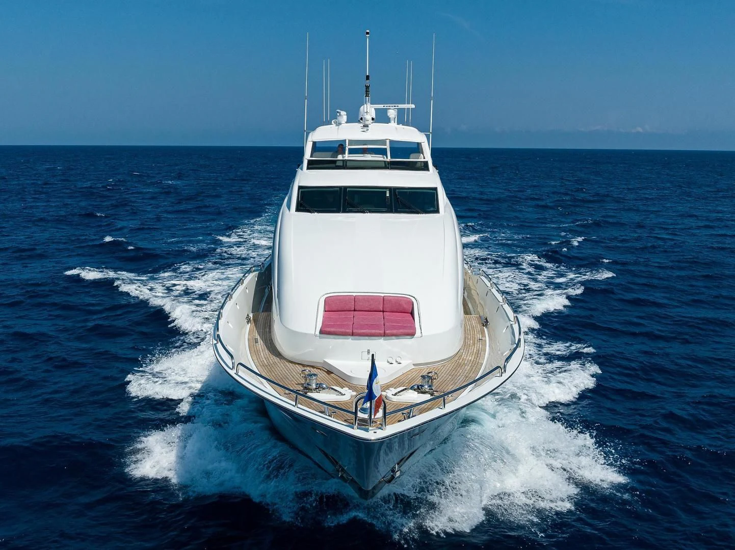 a white boat on the water aboard THE JOB FATHER Yacht for Sale
