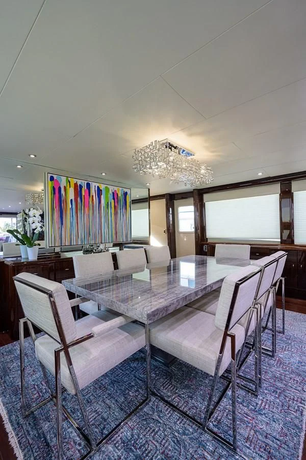 a dining room with a table and chairs aboard THE JOB FATHER Yacht for Sale