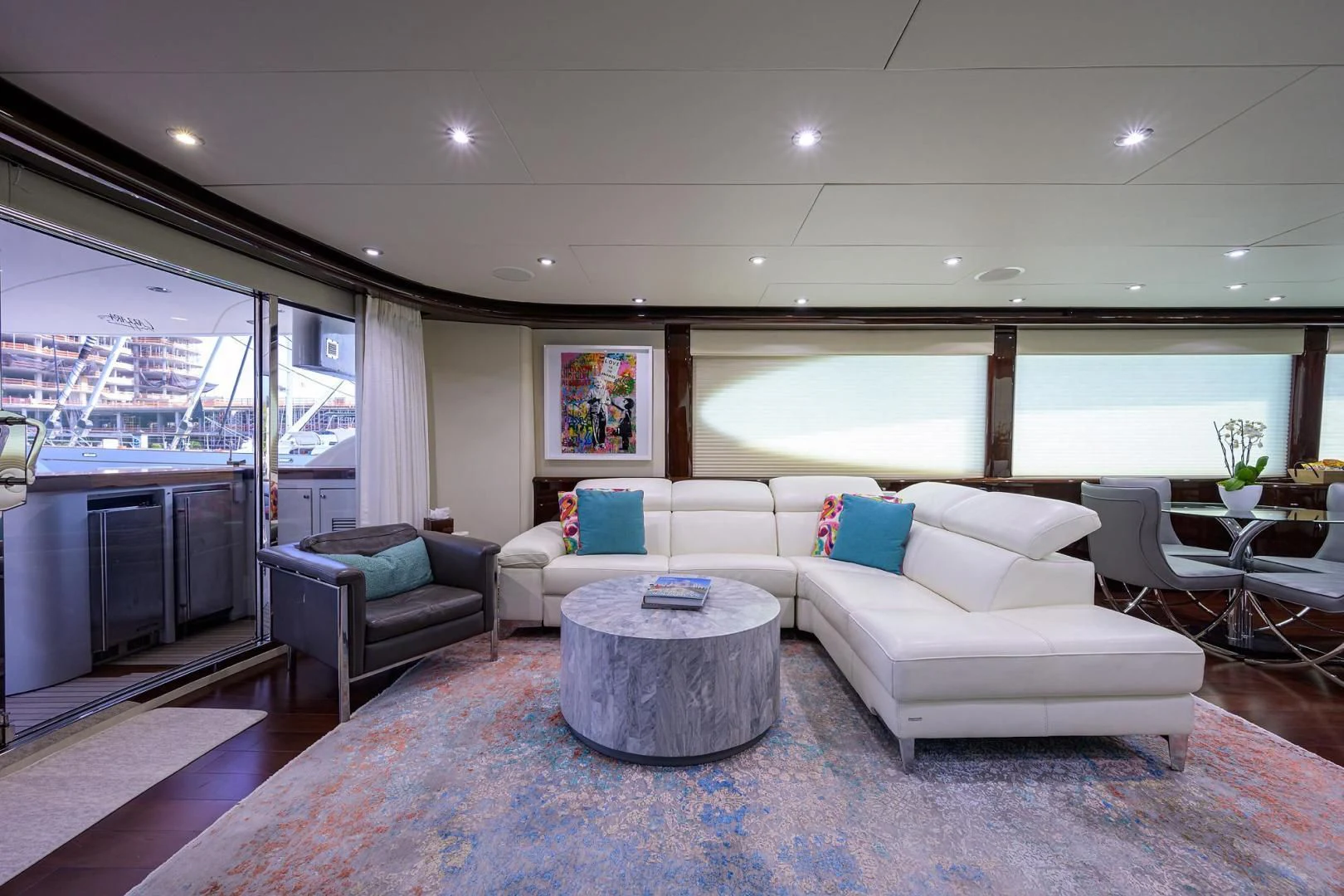 a living room with a large window aboard THE JOB FATHER Yacht for Sale