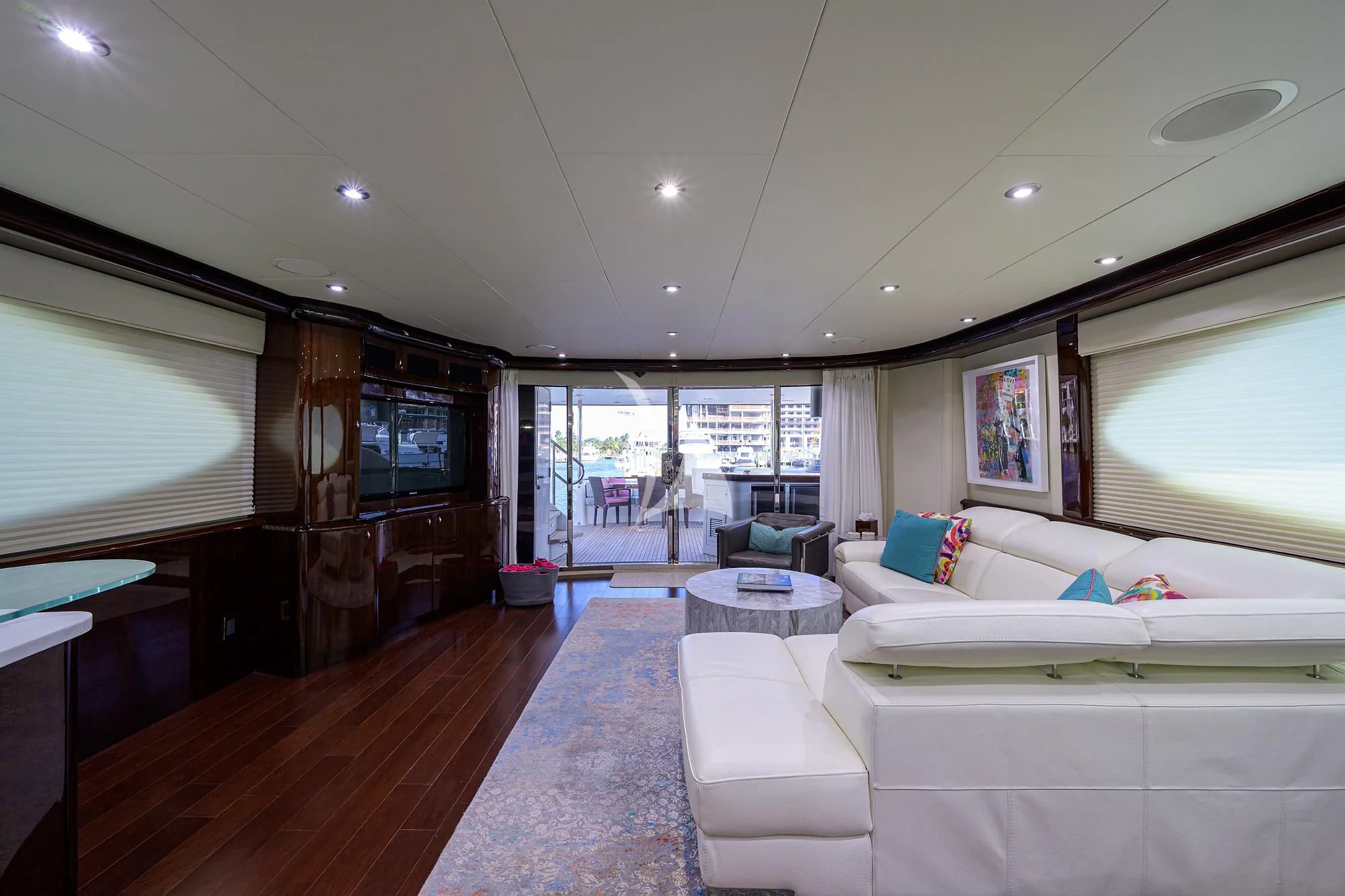 a living room with a large window aboard THE JOB FATHER Yacht for Sale